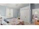 Bright bedroom featuring a floral bedspread and a large closet at 5711 John Anderson Hwy, Flagler Beach, FL 32136