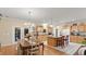 Bright kitchen with light wood cabinets, granite countertops, and an island at 5711 John Anderson Hwy, Flagler Beach, FL 32136