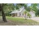 House exterior with a wraparound porch and landscaping at 5711 John Anderson Hwy, Flagler Beach, FL 32136