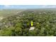 Aerial view of house nestled in a wooded area at 5711 John Anderson Hwy, Flagler Beach, FL 32136
