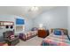 Guest bedroom with twin beds and an adjacent sitting area at 5711 John Anderson Hwy, Flagler Beach, FL 32136