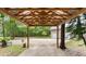 Covered carport with wood beams and a view of the backyard at 5711 John Anderson Hwy, Flagler Beach, FL 32136