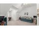 Upstairs bedroom with a sofa and plenty of natural light at 5711 John Anderson Hwy, Flagler Beach, FL 32136
