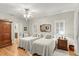 Bright bedroom with twin beds, hardwood floors, and built-in wardrobe at 5711 John Anderson Hwy, Flagler Beach, FL 32136