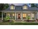 House exterior with a red door and rocking chairs at 5711 John Anderson Hwy, Flagler Beach, FL 32136