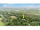 Aerial view of house near water, surrounded by trees at 5711 John Anderson Hwy, Flagler Beach, FL 32136