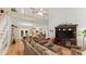Two-story living room with hardwood floors and comfortable seating at 5711 John Anderson Hwy, Flagler Beach, FL 32136