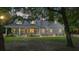 Two-story house with a porch and well-manicured lawn at 5711 John Anderson Hwy, Flagler Beach, FL 32136