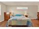 Bright bedroom with a comfortable bed and wood floors at 6008 Sw 103Rd Loop, Ocala, FL 34476