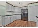 Kitchen boasts stainless steel appliances and wood-look flooring at 6008 Sw 103Rd Loop, Ocala, FL 34476