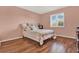 Bedroom with wood-look floors and a queen-size bed at 6008 Sw 103Rd Loop, Ocala, FL 34476