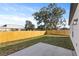 Fenced backyard with grassy area and patio at 828 W 24Th St, Sanford, FL 32771