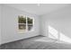 Spacious bedroom with gray carpeting and a large window at 828 W 24Th St, Sanford, FL 32771