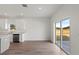 Open concept dining area with sliding glass doors and wood-look flooring at 828 W 24Th St, Sanford, FL 32771