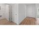 Bright hallway with light wood flooring, leading to laundry and other rooms at 828 W 24Th St, Sanford, FL 32771