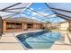 Inviting screened pool with brick pavers at 113 Amberglow Ct, Debary, FL 32713