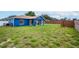 Large backyard with grassy area and brick wall at 1171 Daimler Dr, Apopka, FL 32712