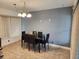 Dining area with black table and chairs, gray walls at 1777 Oasis Ave, Deltona, FL 32725