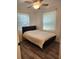 Spacious bedroom with wood-look floors and ceiling fan at 1777 Oasis Ave, Deltona, FL 32725