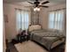 Charming bedroom with leafy wall decor and a queen bed at 1777 Oasis Ave, Deltona, FL 32725