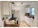 Clean kitchen featuring white cabinets and a window at 1777 Oasis Ave, Deltona, FL 32725