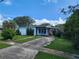 White single-story house with a driveway and landscaping at 1777 Oasis Ave, Deltona, FL 32725