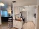 Bright kitchen with white cabinets and modern appliances at 1777 Oasis Ave, Deltona, FL 32725