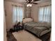 Charming bedroom with leafy wall decor and a queen bed at 1777 Oasis Ave, Deltona, FL 32725
