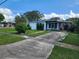 Single story home with driveway and landscaping at 1777 Oasis Ave, Deltona, FL 32725
