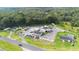 Aerial view of property with multiple buildings and large parking lot at 2490 N Woodland Blvd, Deland, FL 32720