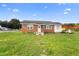 Brick home with a large grassy yard at 2490 N Woodland Blvd, Deland, FL 32720