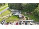 Aerial view of property with pool and multiple buildings at 2490 N Woodland Blvd, Deland, FL 32720