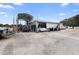 Commercial building with ample parking and covered area at 2490 N Woodland Blvd, Deland, FL 32720