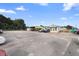 Commercial lot with multiple buildings and parking area at 2490 N Woodland Blvd, Deland, FL 32720