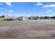 Large commercial lot with ample parking space and multiple buildings at 2490 N Woodland Blvd, Deland, FL 32720