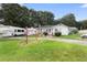 Brick home with detached garage and large yard at 2490 N Woodland Blvd, Deland, FL 32720