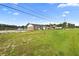 Brick home with a large grassy yard at 2490 N Woodland Blvd, Deland, FL 32720