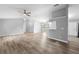 Open concept living room with new flooring, and neutral colors at 2730 Woodland Dr, Edgewater, FL 32141