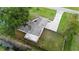 Aerial view of house, canal, and fenced backyard at 2730 Woodland Dr, Edgewater, FL 32141