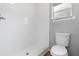 Clean bathroom featuring a white subway tile shower and a toilet at 2730 Woodland Dr, Edgewater, FL 32141