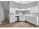 Updated kitchen featuring white cabinets and stainless steel appliances at 2730 Woodland Dr, Edgewater, FL 32141