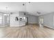 Bright living room featuring laminate flooring and a view of the kitchen at 2730 Woodland Dr, Edgewater, FL 32141