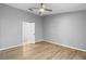 Spacious bedroom with light grey walls and wood-look floors at 2730 Woodland Dr, Edgewater, FL 32141