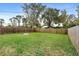 Large fenced backyard with fire pit at 2730 Woodland Dr, Edgewater, FL 32141