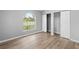 Well-lit bedroom with wood-look floors and a large window at 2730 Woodland Dr, Edgewater, FL 32141