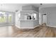 Modern kitchen with white shaker cabinets, stainless steel appliances, and quartz countertops at 2730 Woodland Dr, Edgewater, FL 32141