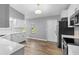 Updated kitchen with white cabinets and stainless steel appliances at 2730 Woodland Dr, Edgewater, FL 32141