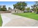 Attractive single-story home with a large front yard and driveway at 2730 Woodland Dr, Edgewater, FL 32141