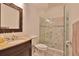 Modern bathroom with a walk-in shower and granite vanity at 3344 S Ridgewood Ave, Port Orange, FL 32129