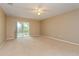 Gathering room featuring sliding glass doors and backyard access at 384 Carina Cir, Sanford, FL 32773